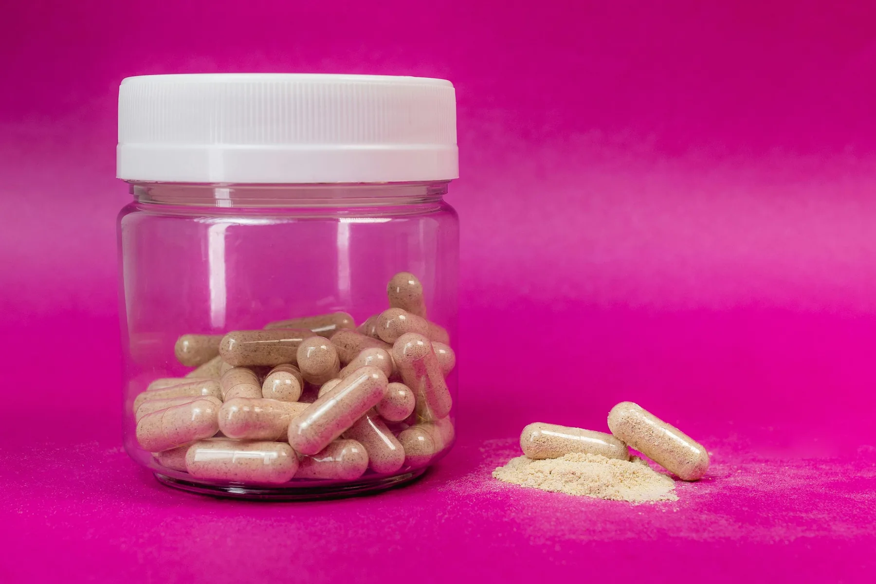 Supplement capsules and powder used to illustrate bulk density control